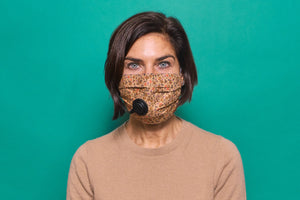 The Suck It Socket adult mask in brown floral with black socket