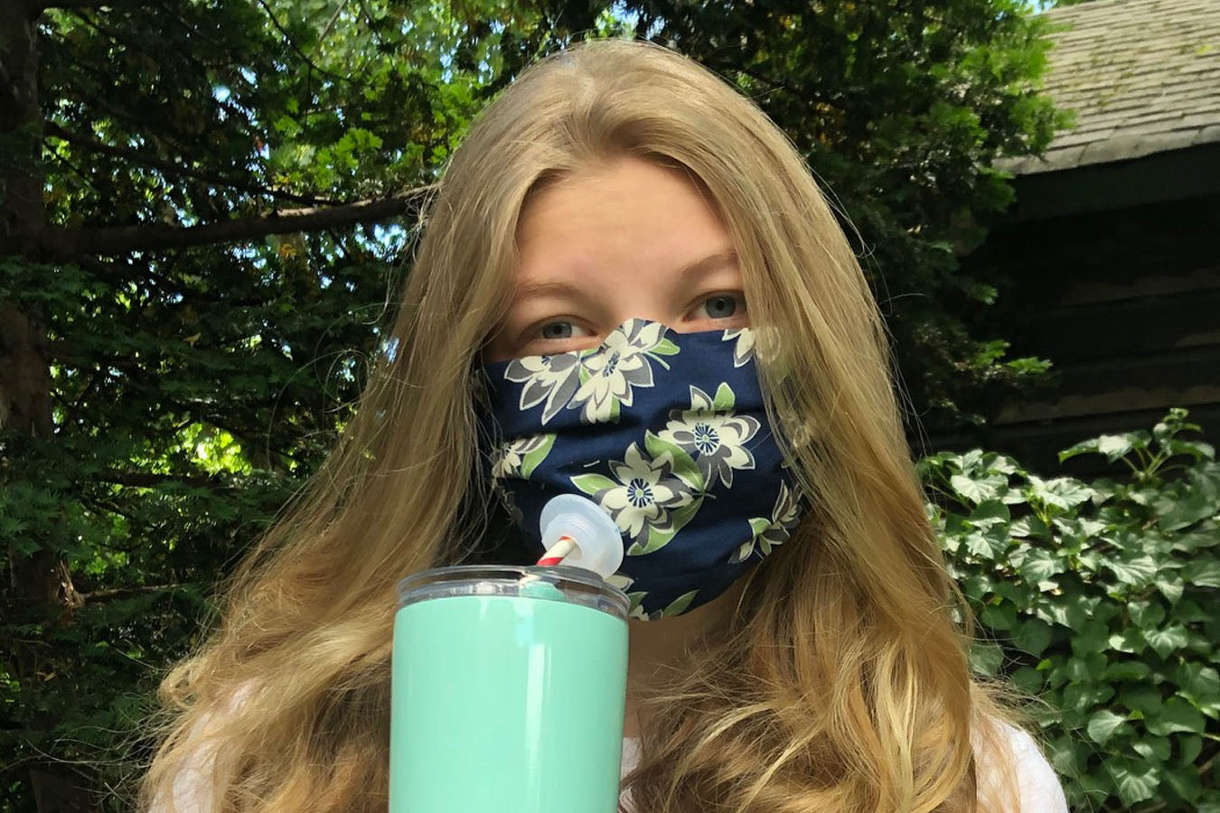 Gillian enjoys a beverage while wearing a Suck It Socket in her own mask