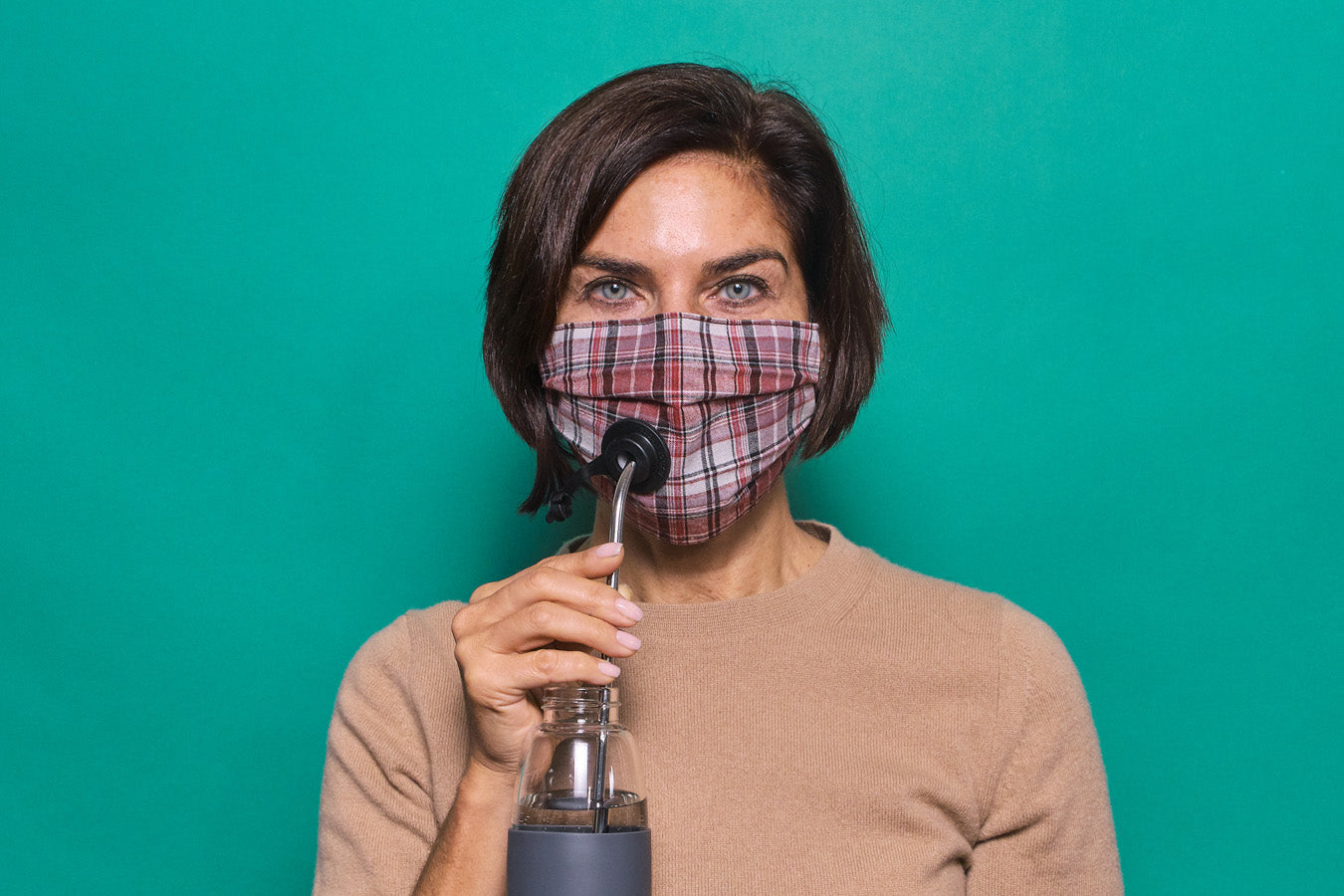 The Suck It Socket Adult mask in plaid with black socket